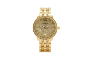 Close-up of golden quartz watch with rhinestone bezel and three-dial face detail
