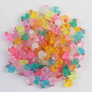 Bulk colorful translucent resin ducks in various shades for DIY craft and decor