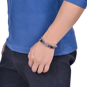 Detail of men's double-layer bracelet with purple amethyst, black stone beads and silver tube