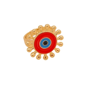 Golden evil eye ring with red enamel details and teardrop metal accents on white background