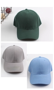 Detailed macro view of cotton twill baseball caps in green, grey, and blue colors