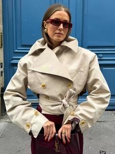 Chic beige double-breasted short trench coat with waist belt and classic lapels