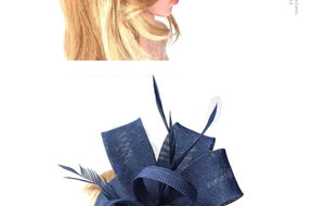 Detail of navy blue fascinator headpiece with layered mesh bow and natural feathers