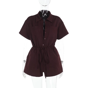 Detail view of burgundy short sleeve romper showing lapel collar and drawstring waist