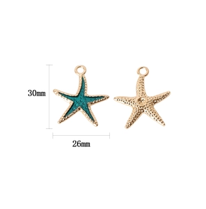 Detailed size view of gold starfish pendants with green enamel for DIY jewelry making