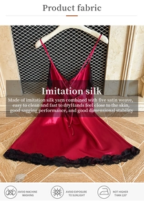 Detail of red silk satin nightdress with black lace trim and fabric care instructions