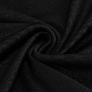 Macro shot of high-quality black knitted fabric texture with elegant pleated draping