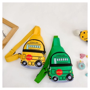 Flat lay of yellow and green cartoon school bus chest bags for children