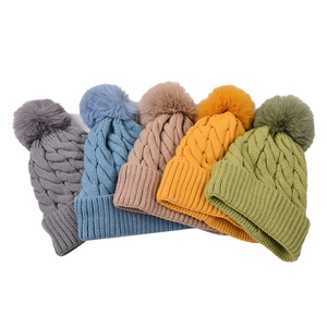 Winter cable knit beanie hats for women with soft faux fur pom and thick thermal texture