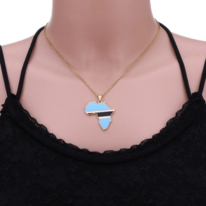 Close-up of Botswana map pendant with blue and black enamel on a gold chain