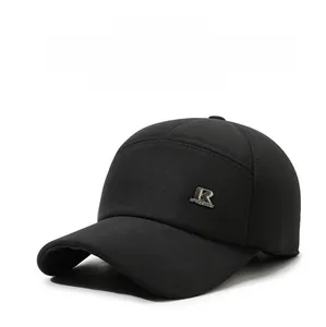 Detail of winter baseball cap with earflaps, black warm material and metal R logo