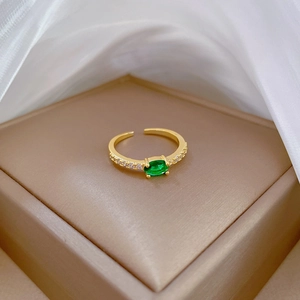 Adjustable 18K gold ring with oval green zircon stone and sparkling side accents