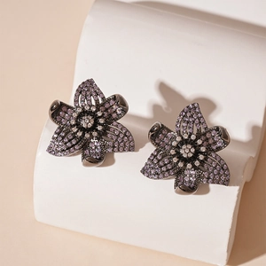 Vintage flower stud earrings with purple zircons and dark gunmetal finish for women