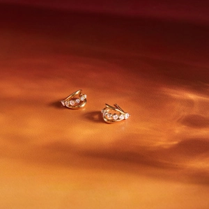 Double-layered gold-plated C-shaped earrings with sparkling cubic zirconia inlay