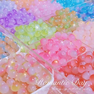 Close-up of 8mm frosted glass beads in a storage box for DIY jewelry making