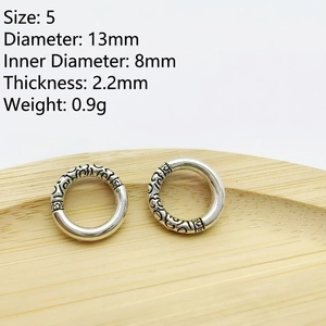 Detail of silver vintage ring bead with engraved patterns 13mm diameter for jewelry making