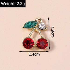 Detail view of red crystal cherry pendant with dimensions 1.9cm by 1.4cm and weight 2.2g