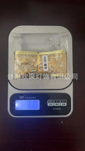 Weight measurement of 40 LED warm white Christmas ribbon fairy light on a scale
