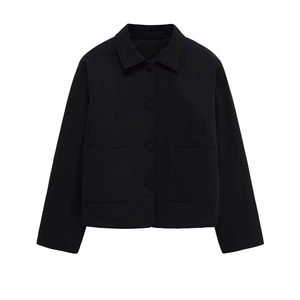 Classic black lapel button jacket with large patch pockets in a minimalist street style