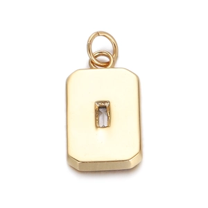 Macro shot of gold rectangle pendant with clear emerald-cut gemstone and dual rings