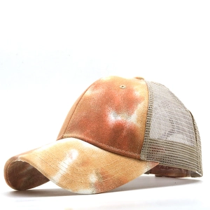 Tie-dye baseball cap in orange-brown and white with breathable light gray mesh back