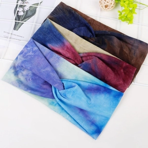 Four tie-dye knotted yoga headbands in blue, purple, beige and brown color options