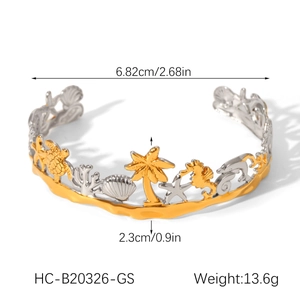 Detail view of tropical beach theme cuff bracelet with palm tree and sea creature charms