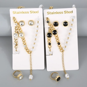 Detail of gold-plated stainless steel jewelry sets featuring pearls and square crystals