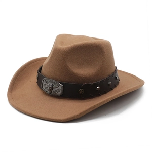 Vintage dark brown felt cowboy hat with leather steer skull band and wide brim