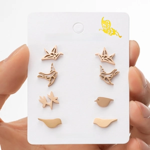 Set of four stainless steel bird earrings including paper crane and swallow designs