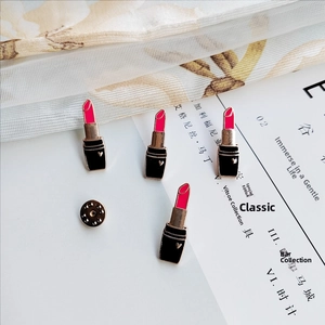 Cute pink and black lipstick enamel brooch pins with heart pattern on white background