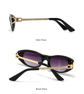 Detail view of oval punk sunglasses with purple gradient lenses and gold metal temples