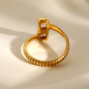 Minimalist gold stainless steel open ring with two rectangular zircons in a 45-degree view