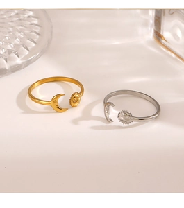 Detailed close-up of sun and moon adjustable rings in gold and silver stainless steel