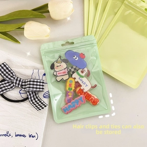 Detail of macaron colored resealable plastic bags for hair clips and accessories
