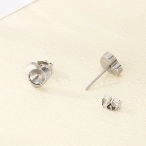 Detailed view of silver stainless steel heart-shaped stud earring settings for DIY jewelry