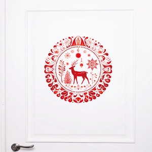Red Christmas reindeer mandala wall sticker on a white door for festive holiday decoration