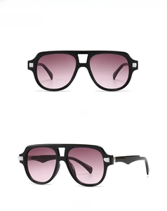 Close-up of retro black frame sunglasses with pink gradient lenses from multiple angles