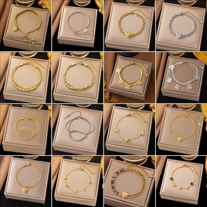 Variety of stainless steel gold and silver heart bracelets in jewelry display box