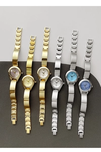 Detailed top view of luxury bangle quartz watches with various colorful sunray dials