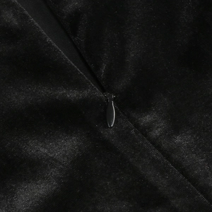 Detail of invisible zipper stitching on black velvet evening dress with soft texture