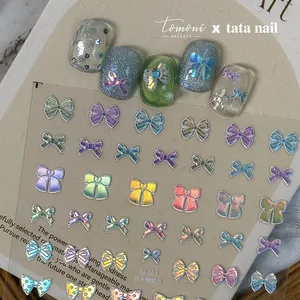 Macro shot of aurora bow nail stickers with holographic laser effect on model nails