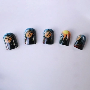 Short square Halloween press-on nails featuring a dark castle and full moon on blue sky