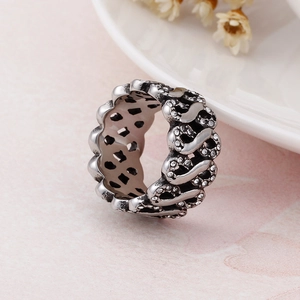 Detail of vintage silver twist ring with micro-pave white zircon and antique finish
