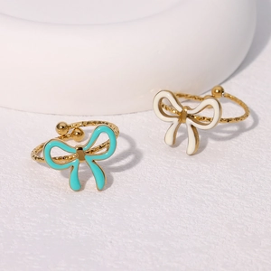 Elegant gold-plated stainless steel bow rings with blue and white enamel inlay