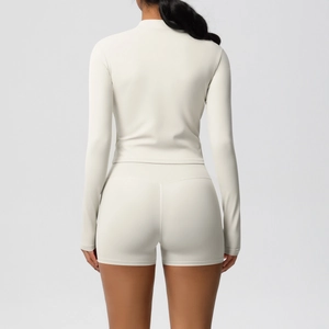 Back view of beige double-sided brushed yoga set with zip-up jacket and fitness shorts