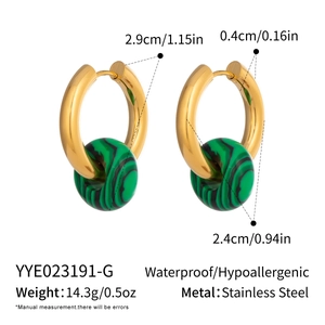 Macro shot of 18K gold-plated stainless steel hoops with natural green stone textures