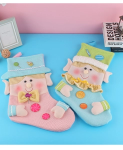 Close-up of knit Christmas elf stockings with decorative ears and hanging loops