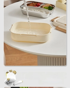 Detailed view of 304 stainless steel lunch box with integrated cutlery storage space