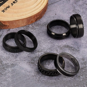 Men's black titanium steel ring set featuring rotating chain and matte punk styles
